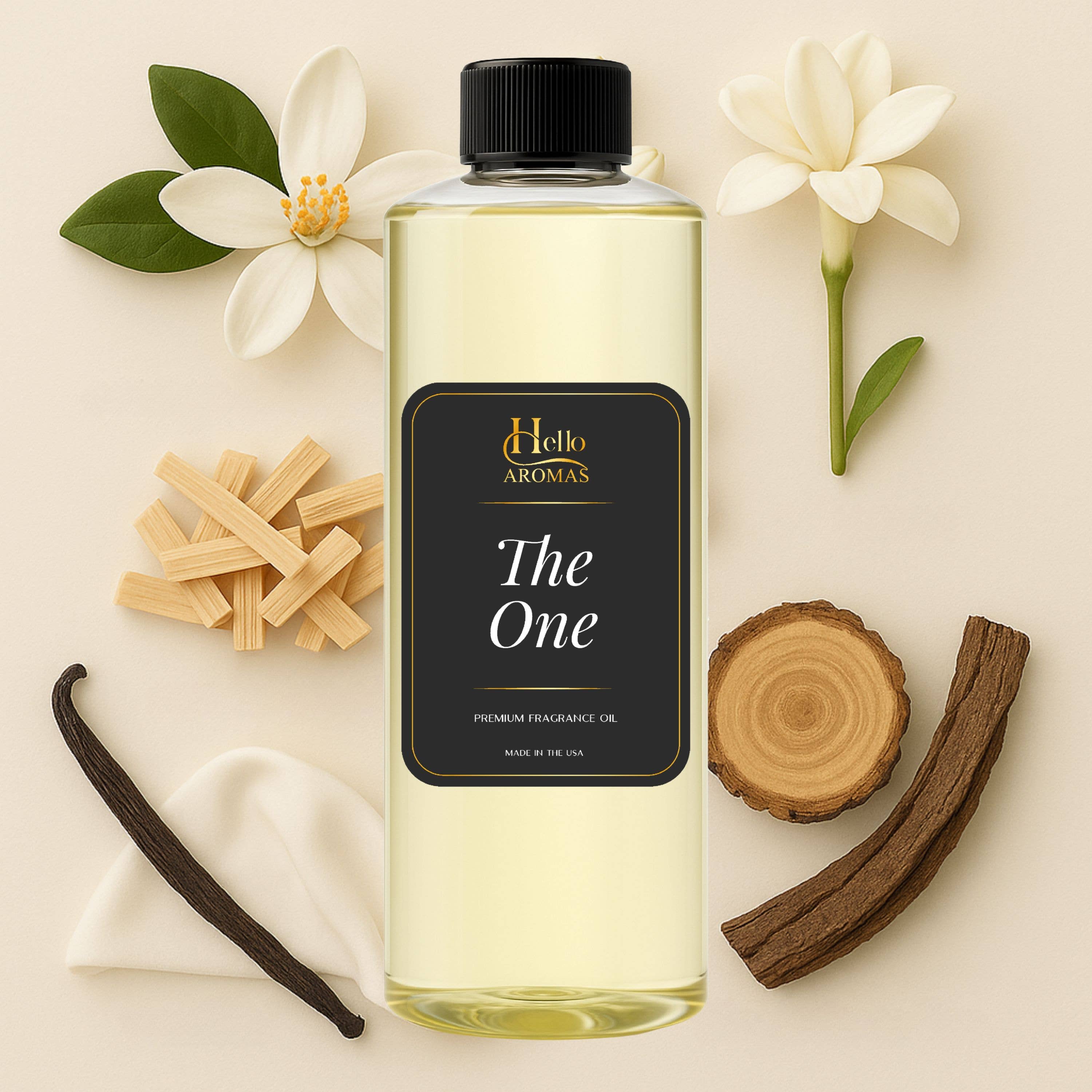 Bottle of 'The One' fragrance oil by Hello Aromas with vanilla bean, wooden sticks, and flowers on a beige background