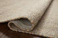 Close-up of a textured beige fabric surface